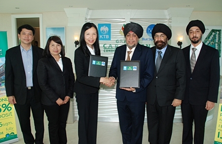 Surjeet Singh Chawala, Director of Blue Sky Group (4th from left) and Jaree Wuthisanti, Krung Thai Bank Senior Executive Vice President Corporate Banking Group 1 (3rd from left) shake hands on the 1,150 MB loan agreement to support Grande Caribbean Condo Resort Pattaya.